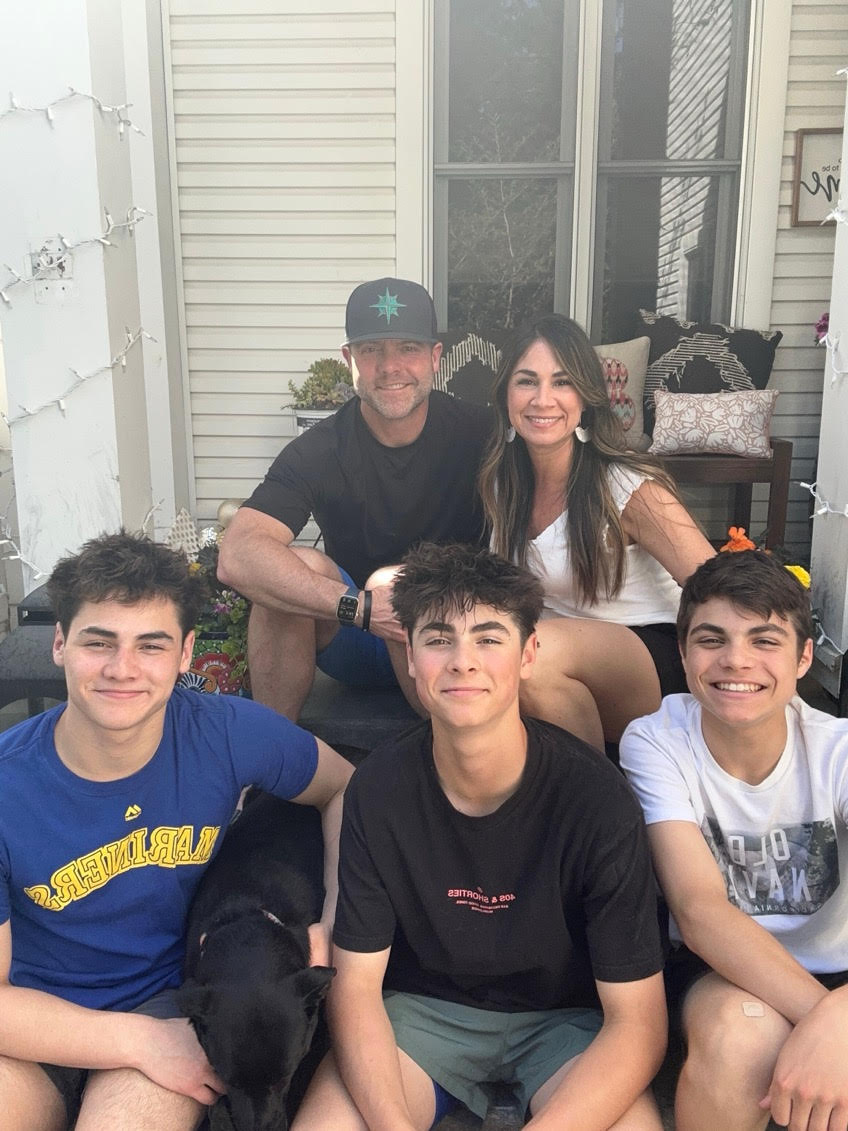 Donnie Murrell with his wife, three sons, and family dog at home in Hayden Lake, Idaho